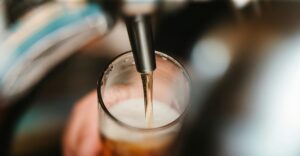 image of beer being poured into a glass 