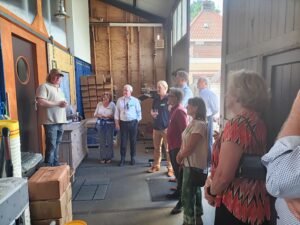 People listening to Jeroen Bunnink as he explains how his brewery started.