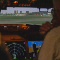 IMG_7675 People in a flight simulator.