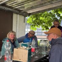 pic 10 Group of people listening to a talk about the city vineyard and tasting some of the wine