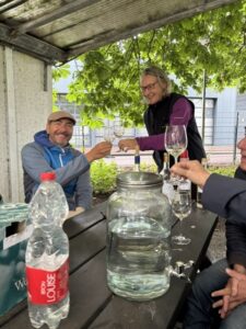 Group of people listening to a talk about the city vineyard and tasting some of the wine