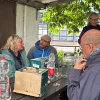 pic 9 Group of people listening to a talk about the city vineyard and tasting some of the wine